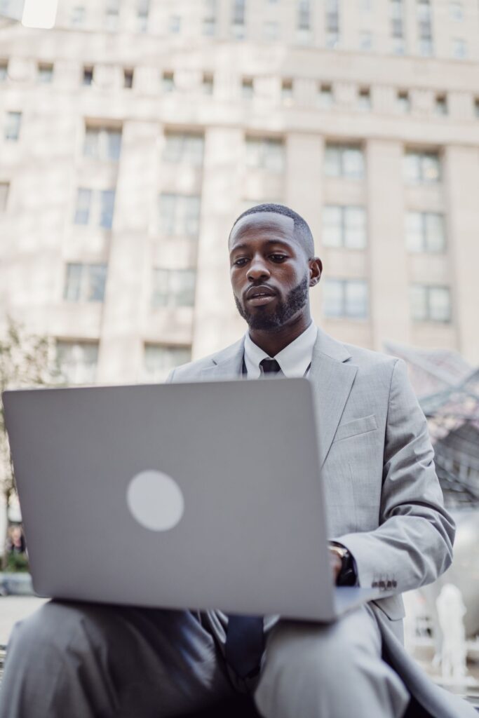 A professional working on a laptop